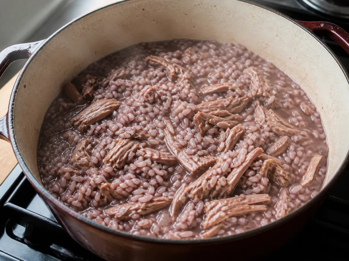 Preparação de Arroz de Pato com Vinho Tinto durante a confeção