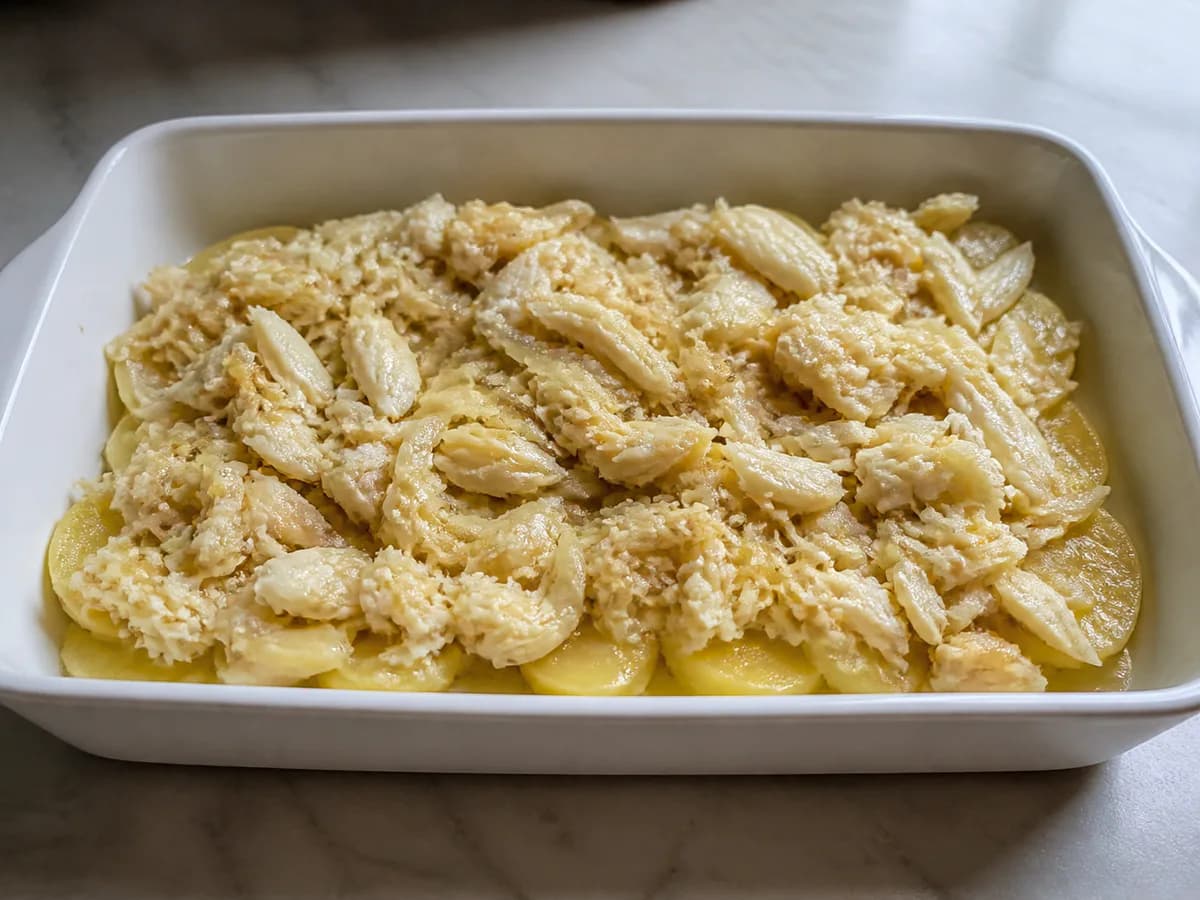 Pormenor de uma porção de Bacalhau Cremoso Receita da Sogra