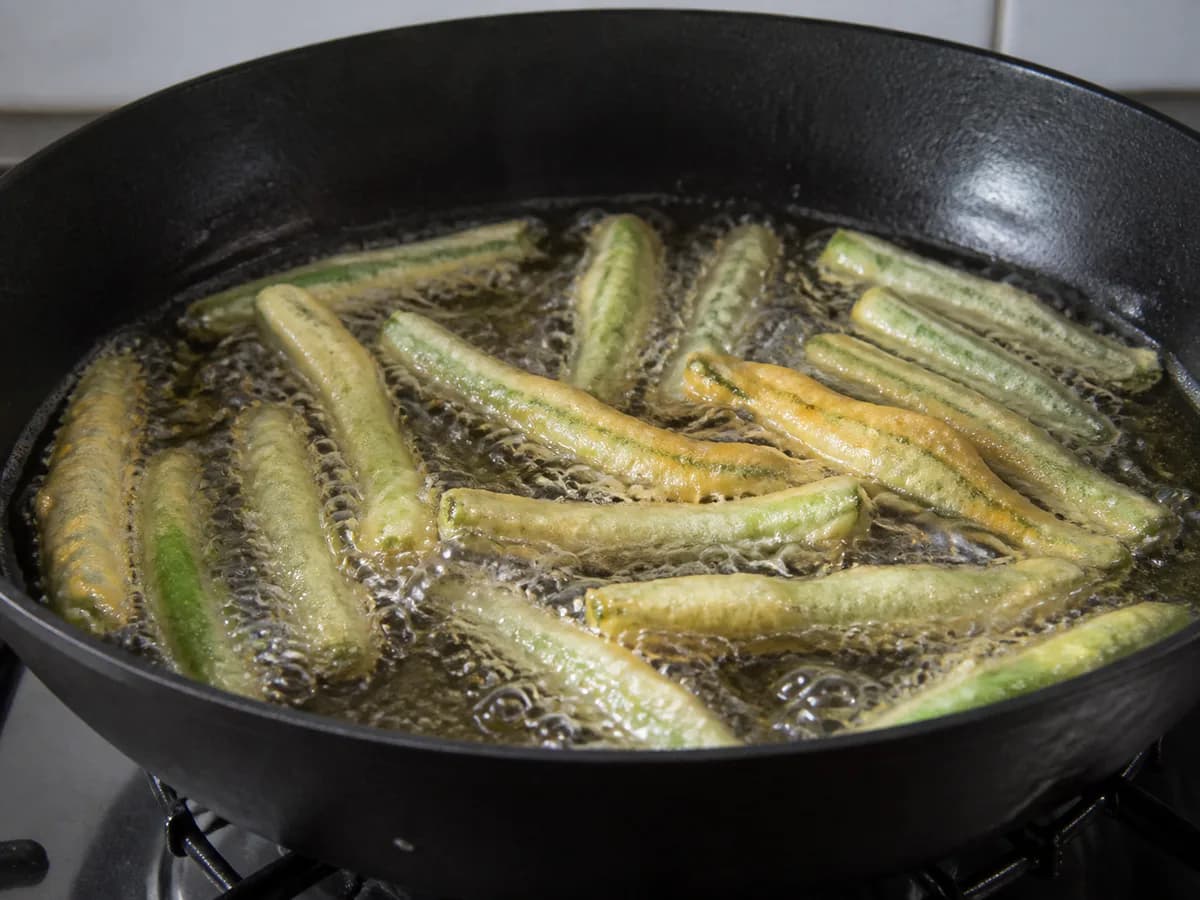 Preparação de Peixinhos da Horta durante a confeção